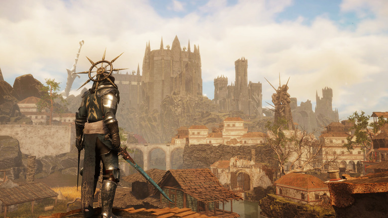 A Tainted Grail character overlooking a city at sunrise