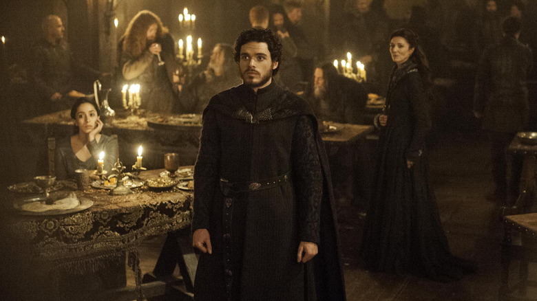 Richard Madden as Rob Stark, standing at his wedding in Game of Thrones.