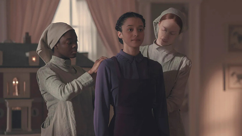 Chase Infiniti as Agnes, being dressed in "The Testaments."