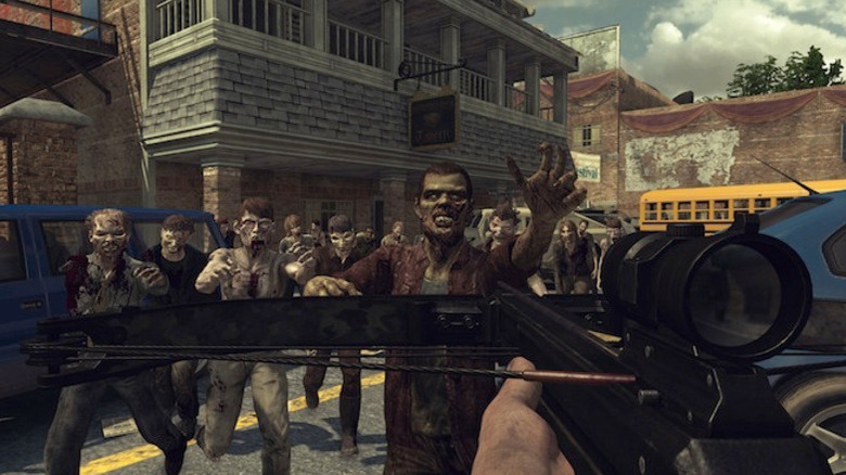 Daryl Dixon aims a crossbow at a horde of attacking zombies in The Walking Dead: Survival Instinct