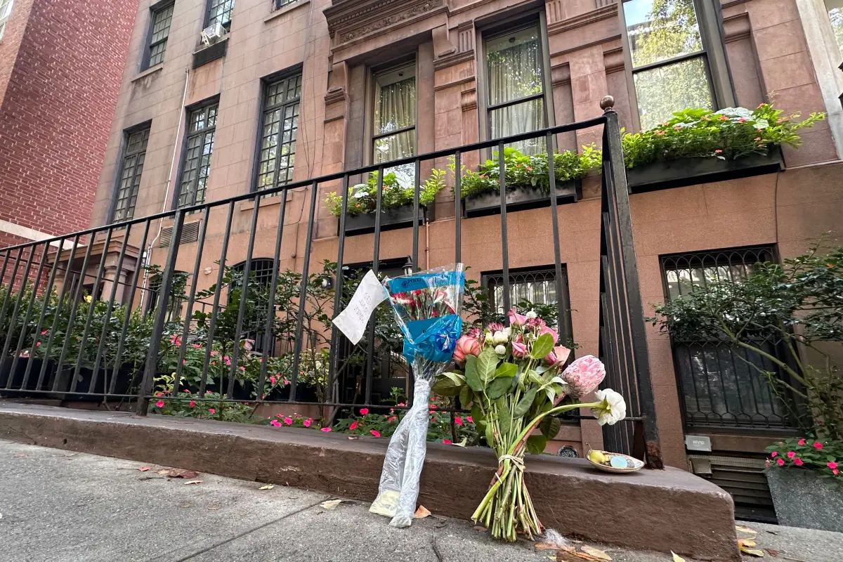 Flowers rest outside of Gloria Steinem's Manhattan apartment on Thursday.