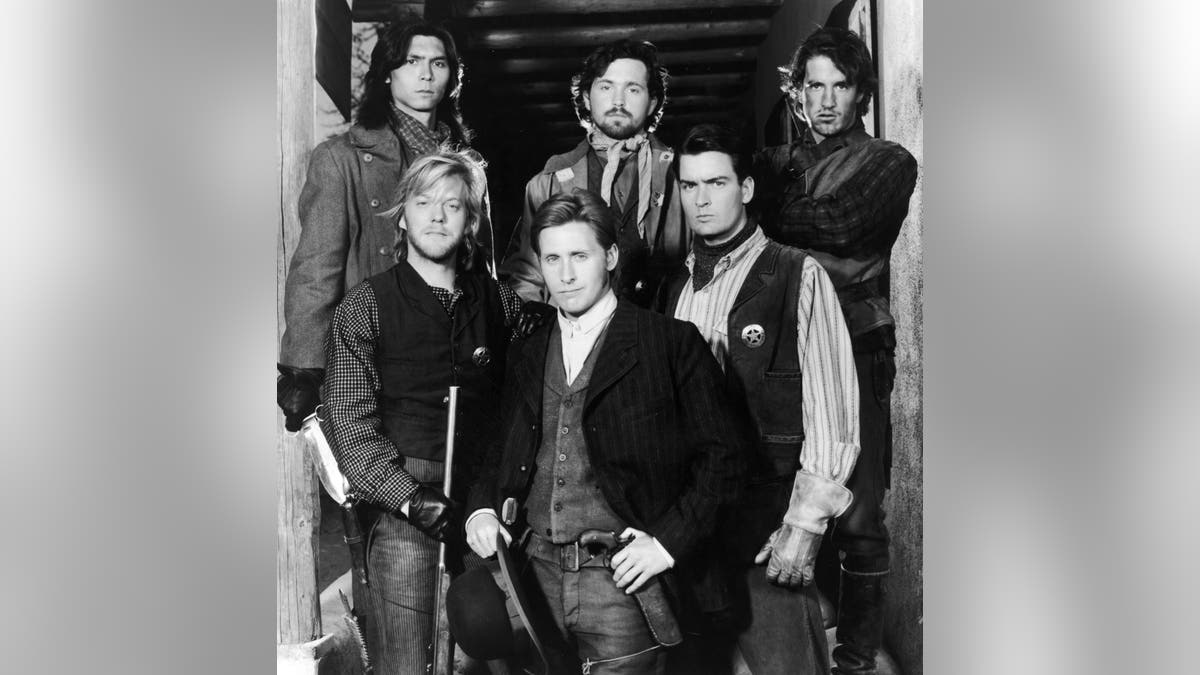 Lou Diamond Phillips, Casey Siemaszko, Dermot Mulroney, Kiefer Sutherland, Emilio Estevez and Charlie Sheen pose for a promotional portrait.