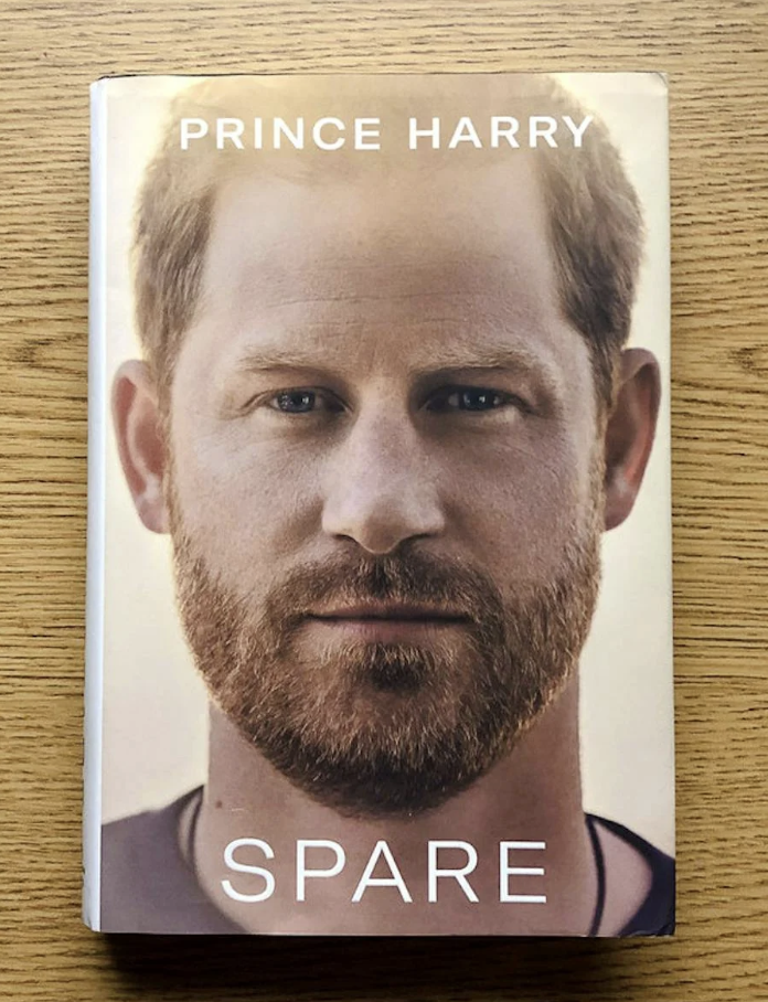 Book cover titled "Spare" by Prince Harry, showing a close-up of his face