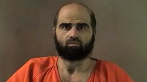 Bell County Sheriff's Office/Reuters An undated handout image of Hasan that was released by authorities in 2012