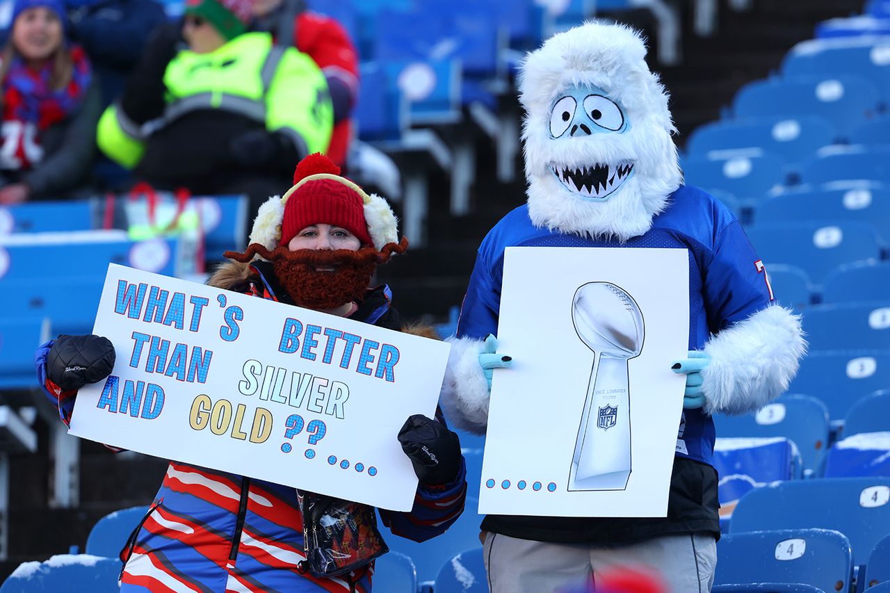 Fans with signs watch players warmup before the game between the Buffalo Bills and the New England Patriots at Highmark Stadium on Dec. 22, 2024 in Orchard Park, New York.Credit: Timothy T Ludwig/Getty