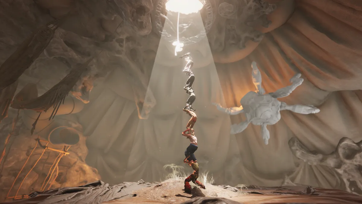 Six avatars on each other's shoulders forming a tower towards an opening in a textile draped cave with white 6-legged spider in the background.