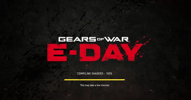 The image shows the 'Gears of War E-Day' splash screen with the text 'Compiling Shaders - 100%' and a message reading 'This may take a few minutes.'