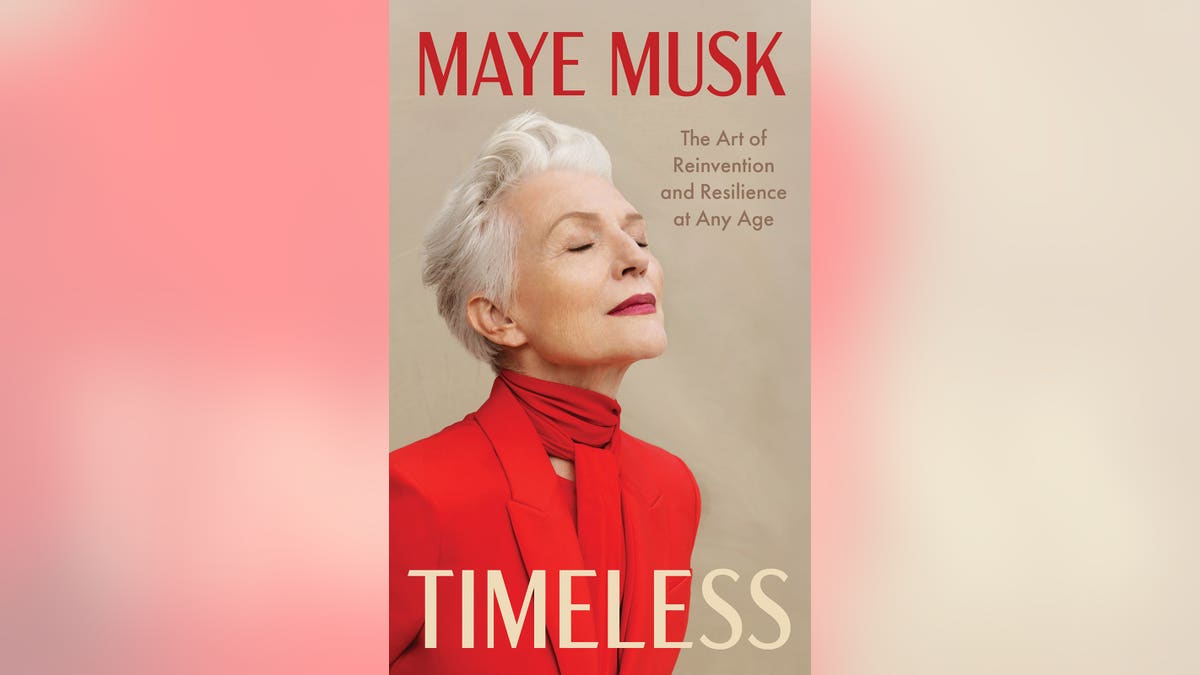 Maye Musk posing in red for the cover of her book Timeless.
