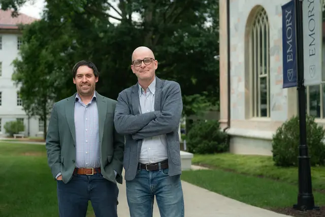 Pablo Montagnes and Zachary Peskowitz stand together on Emory quad