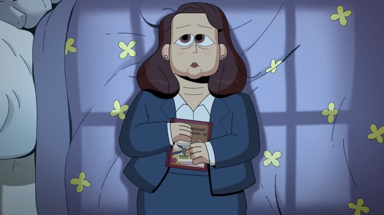 Carol Kohl (Martha Kelly) lays on a bed holding a yearbook in Carol & the End of the World