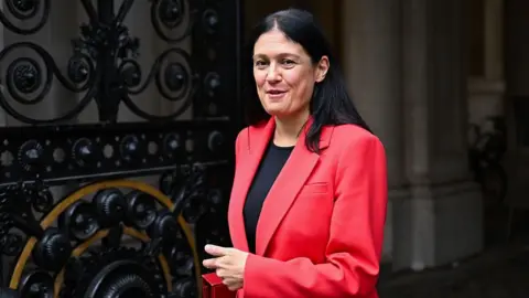 Getty Images Lisa Nandy wearing a pink blazer and black t shirt.
