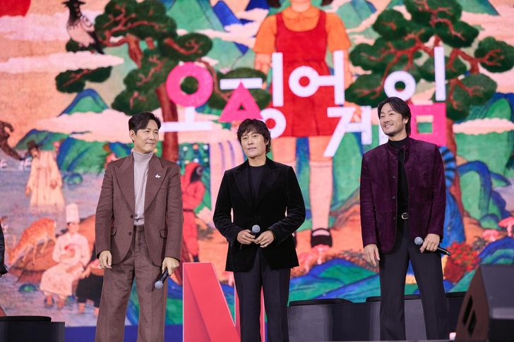 Stars of 'Squid Game' Lee Jung-jae, left, Lee Byung-hun, center, and Park Hae-soo attend the Netflix Janchi event held at Oil Tank Culture Park in Seoul, Saturday. Courtesy of Netflix