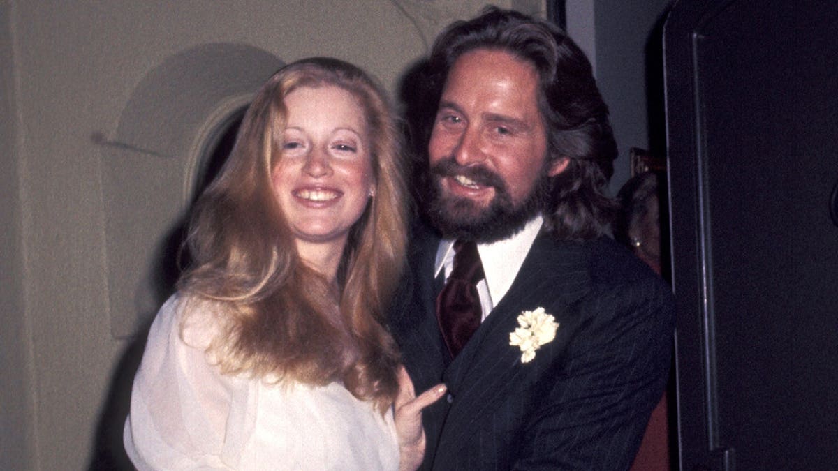 Michael Douglas and Diandra Douglas pose together.