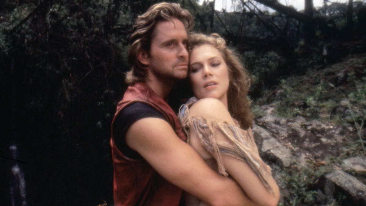 Michael Douglas and Kathleen Turner on the set of Romancing the Stone in 1984