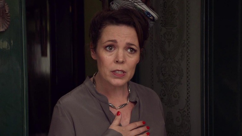 Olivia Colman as Godmother with her hand on her chest in Fleabag