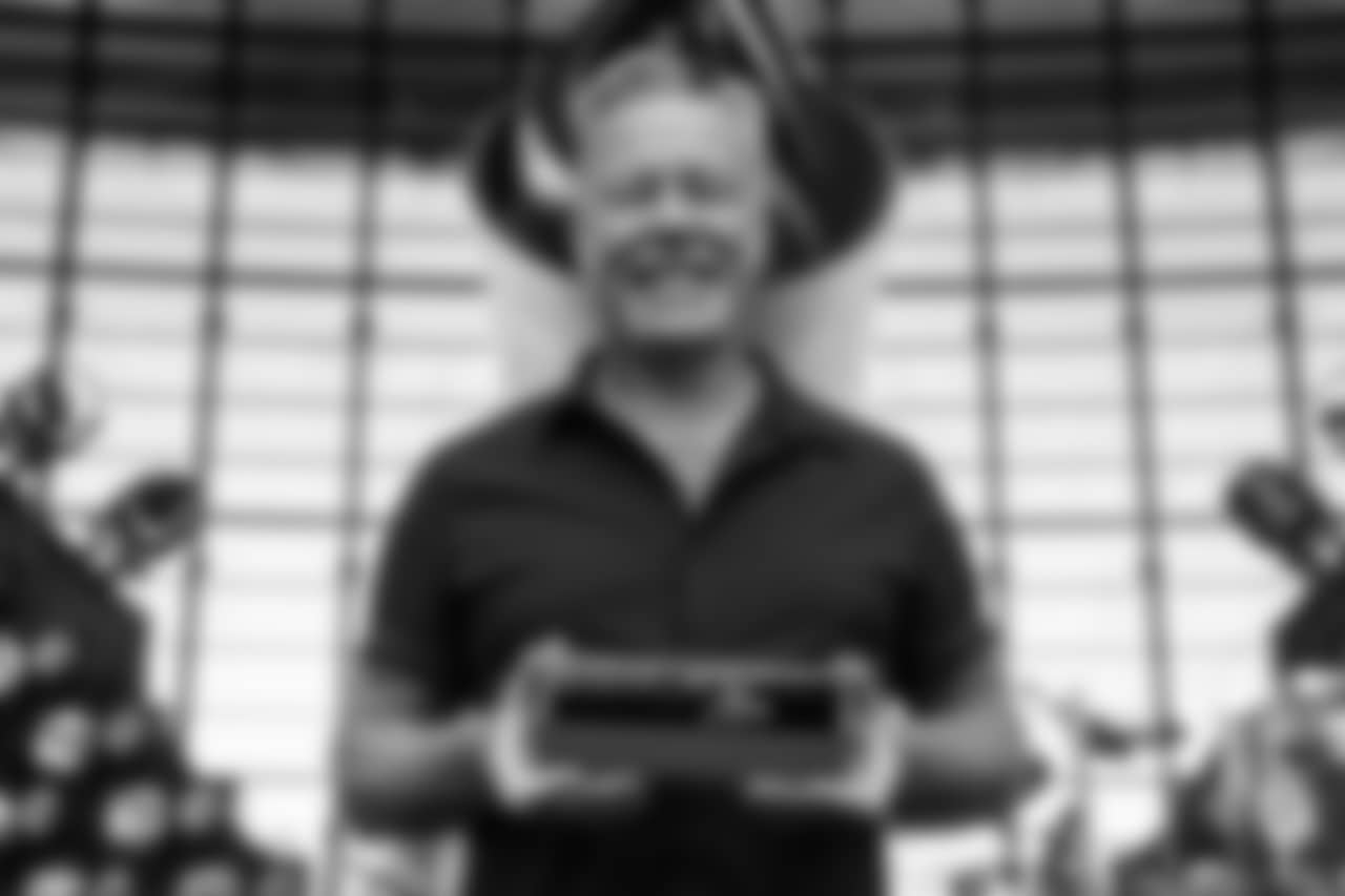Lead singer of Metallica and Rock & Roll Hall of Famer James Hetfield signs the Al Davis Memorial torch before the Las Vegas Raiders' regular season home game against the Los Angeles Rams at Allegiant Stadium.