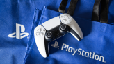 PS5 DualSense controller on a PS5-branded tote bag