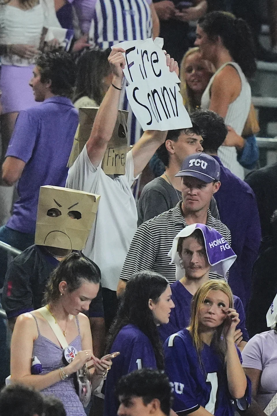 TCU fans in the stands react during the second half of an NCAA college football game against BYU, Saturday, Oct. 3, 2026, in Fort Worth, Texas. (AP Photo/LM Otero)