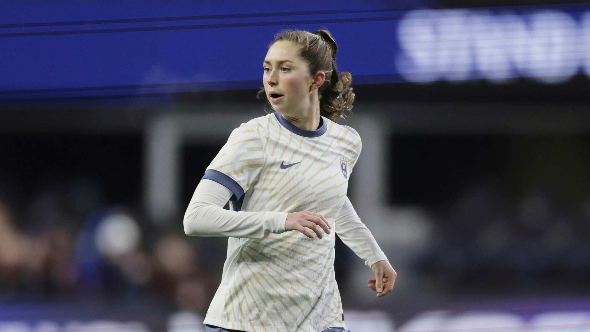 Seattle Reign midfielder Maddie Mercado follows the action as she...