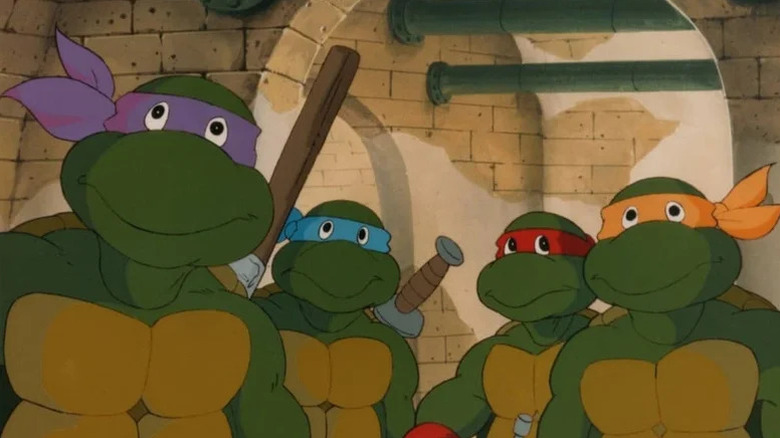 Donatello (Barry Gordon), Leonardo (Cam Clarke), Raphael (Rob Paulsen), and Michelangelo (Townsend Coleman) stand in the sewers in Teenage Mutant Ninja Turtles (1987)