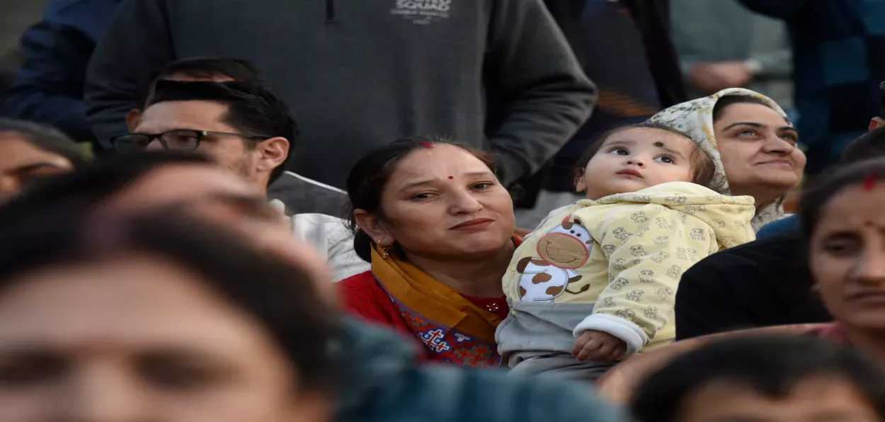 A Kashmiri Pandit woman with her child watching burning of Ravana's effigy in Srinagar (All pics by Basit Zargar)